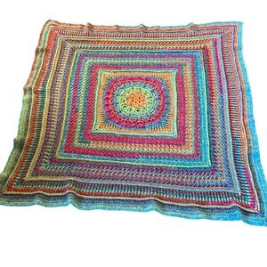Hand crocheted pink, blue and green afghan